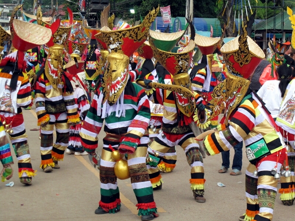 Masked men dancing after the procession