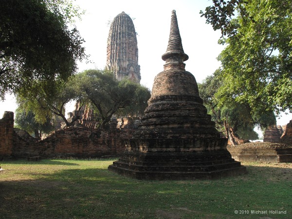 One of many reliquary stupas, with the main tower behind