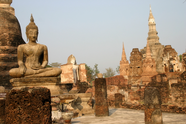 Some of the many Buddhas and pagodas of Wat Mahathat in Sukhothai