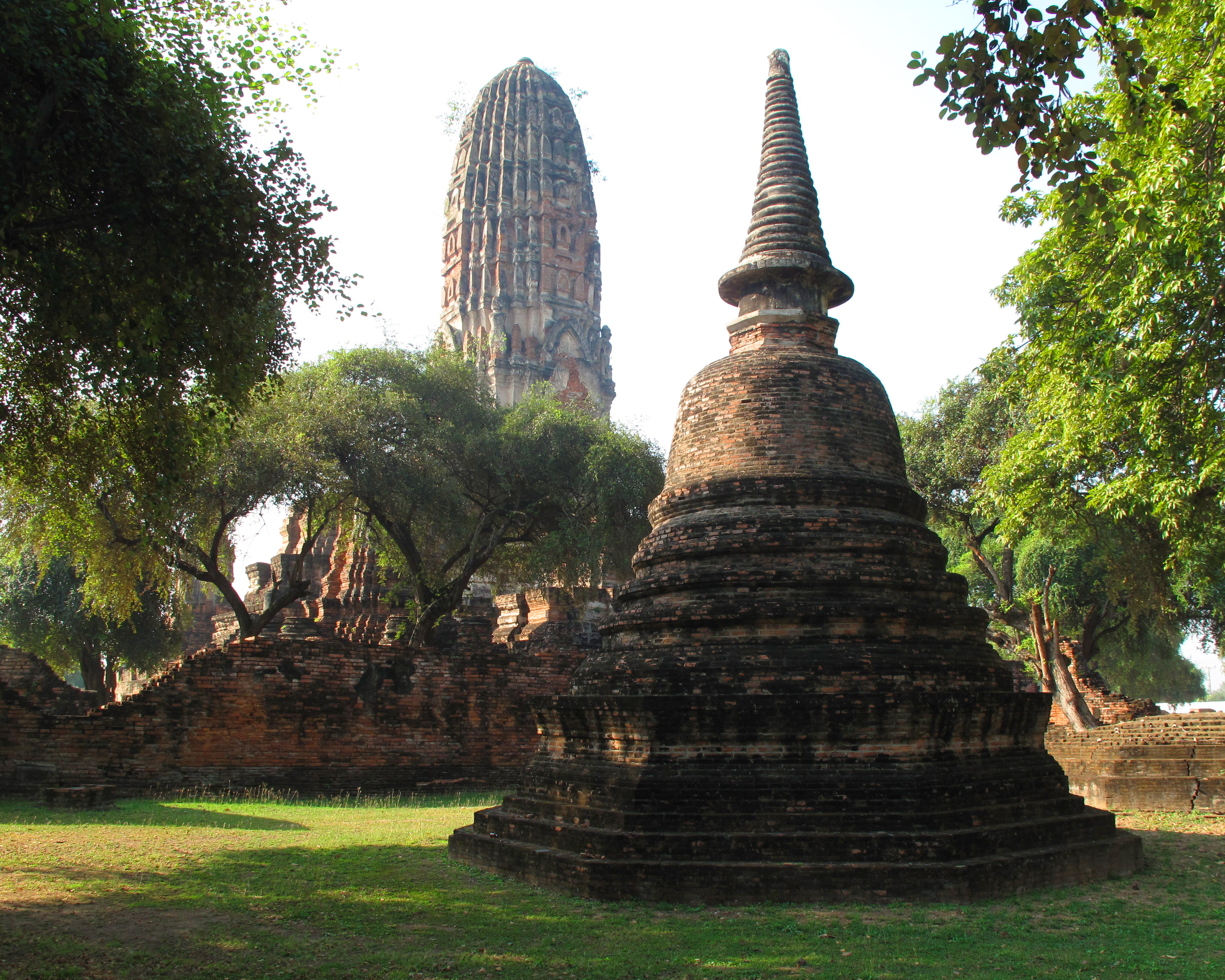 One of many reliquary stupas, with the main tower behind