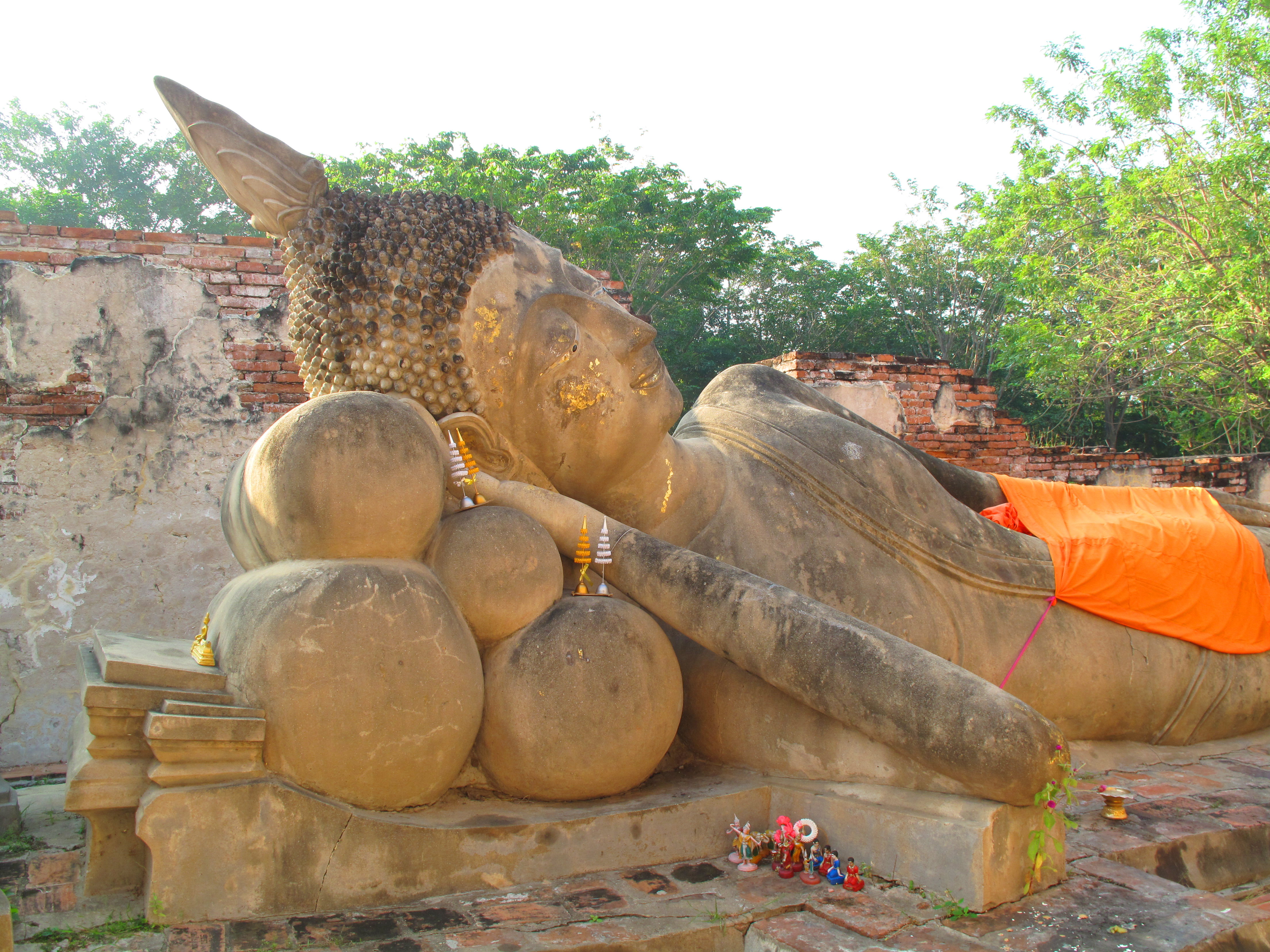 A reclining Buddha image in the ruins of a side chapel