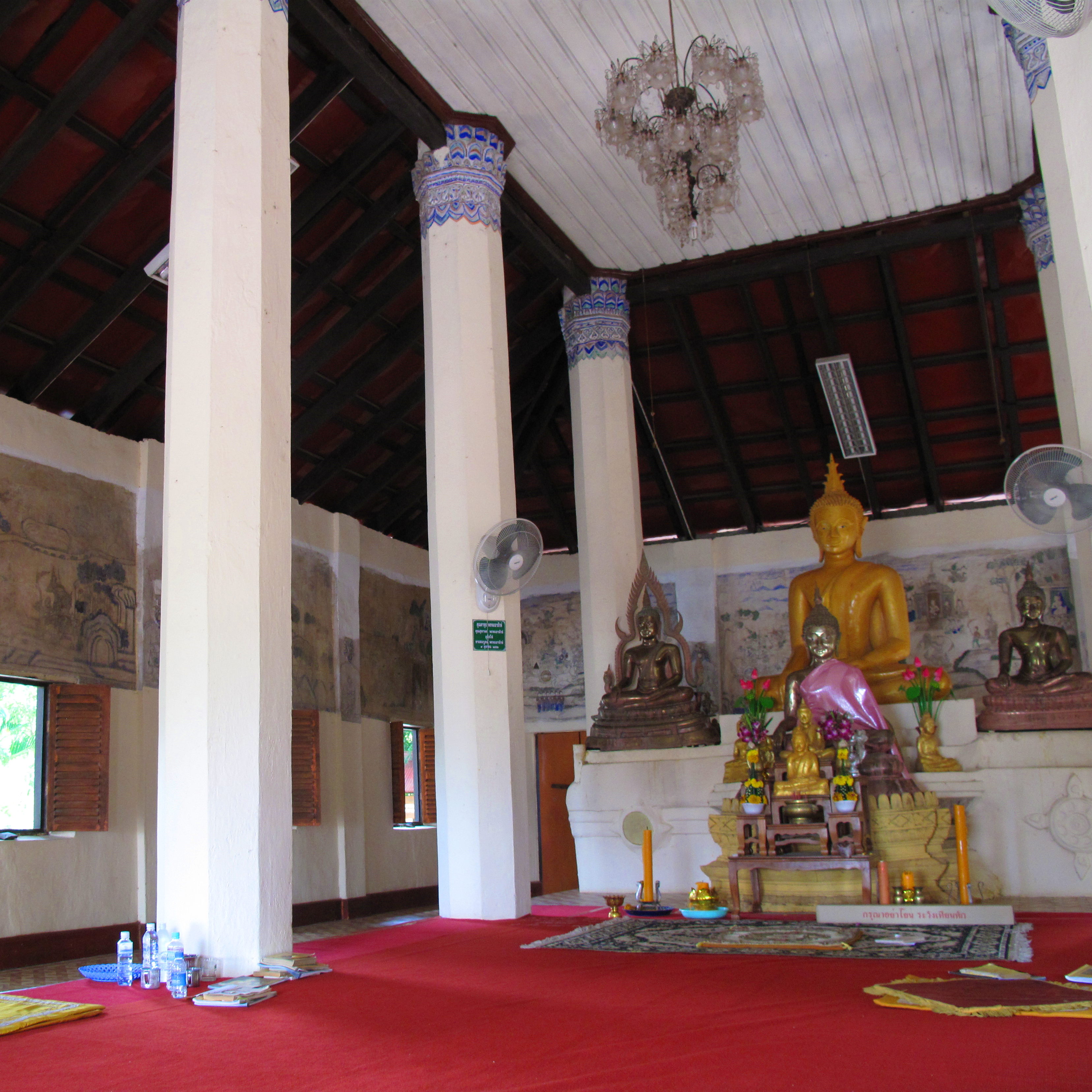 The altar and some of the murals of the main chapel