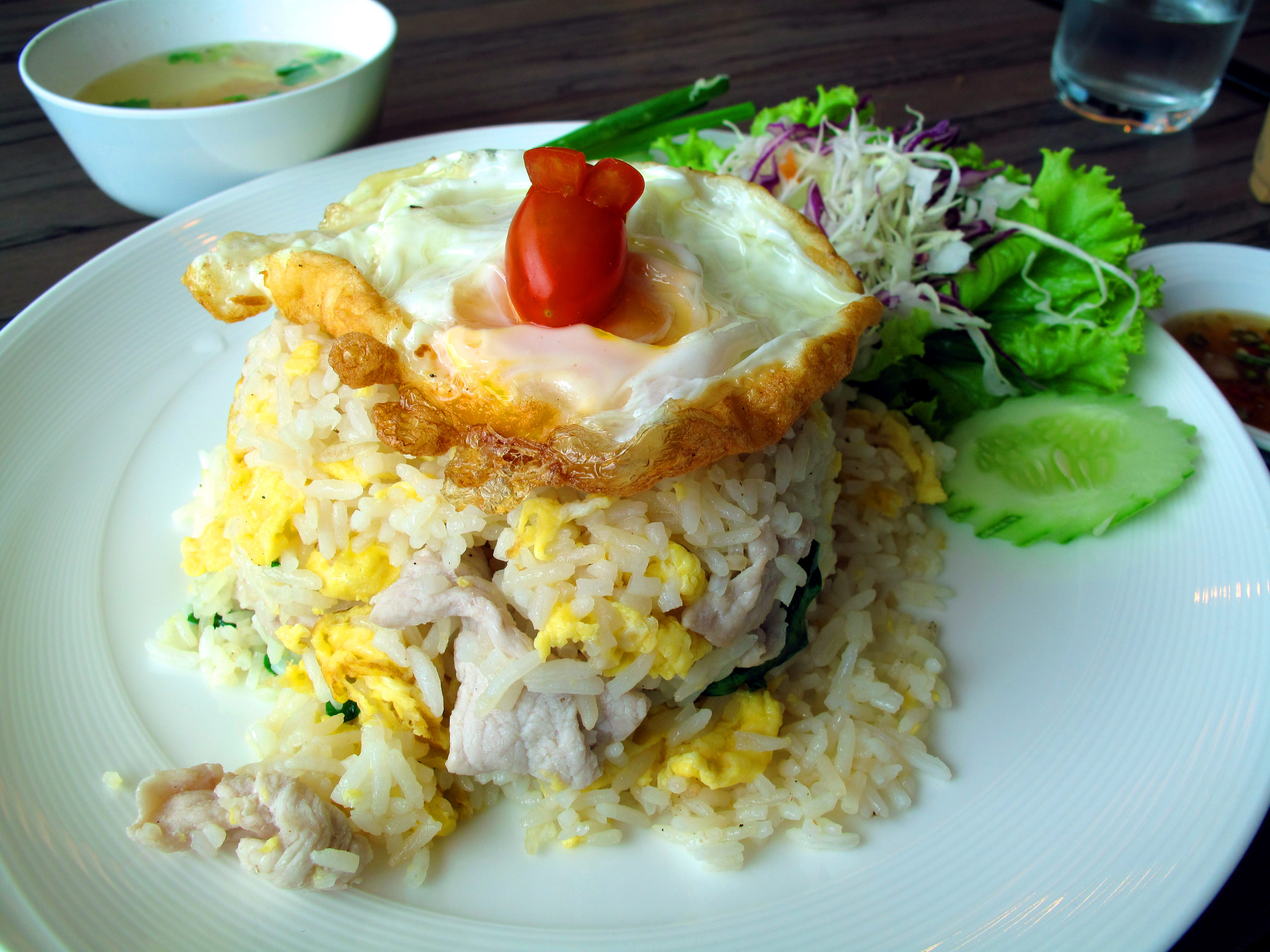 A simple meal of pork fried rice, with a bunny on top